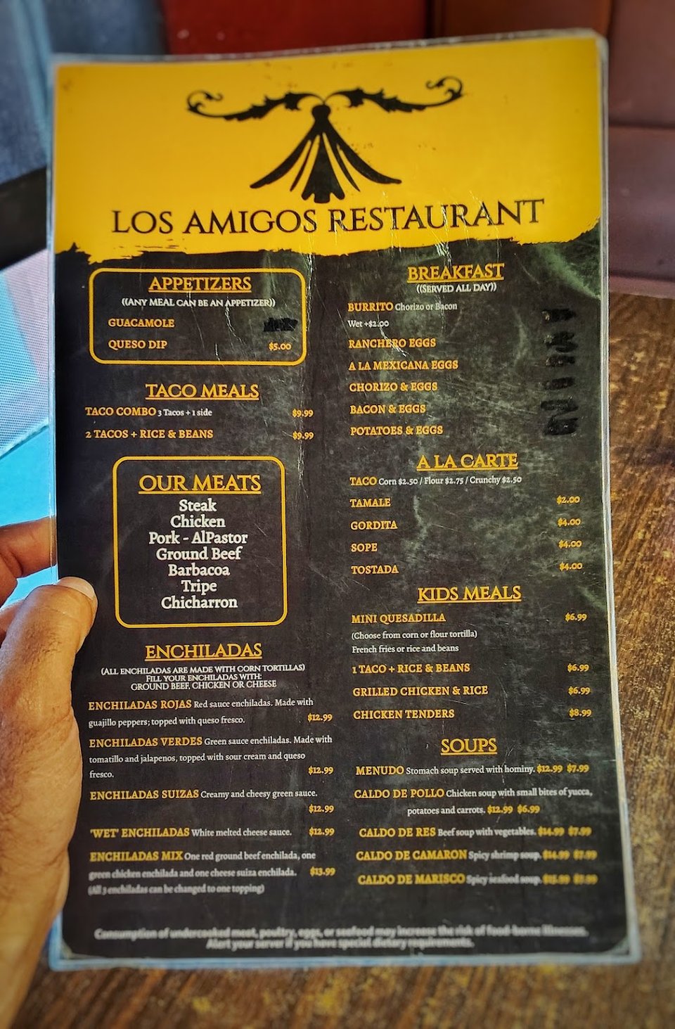 Printed menu showing Mexican dishes and drinks.
