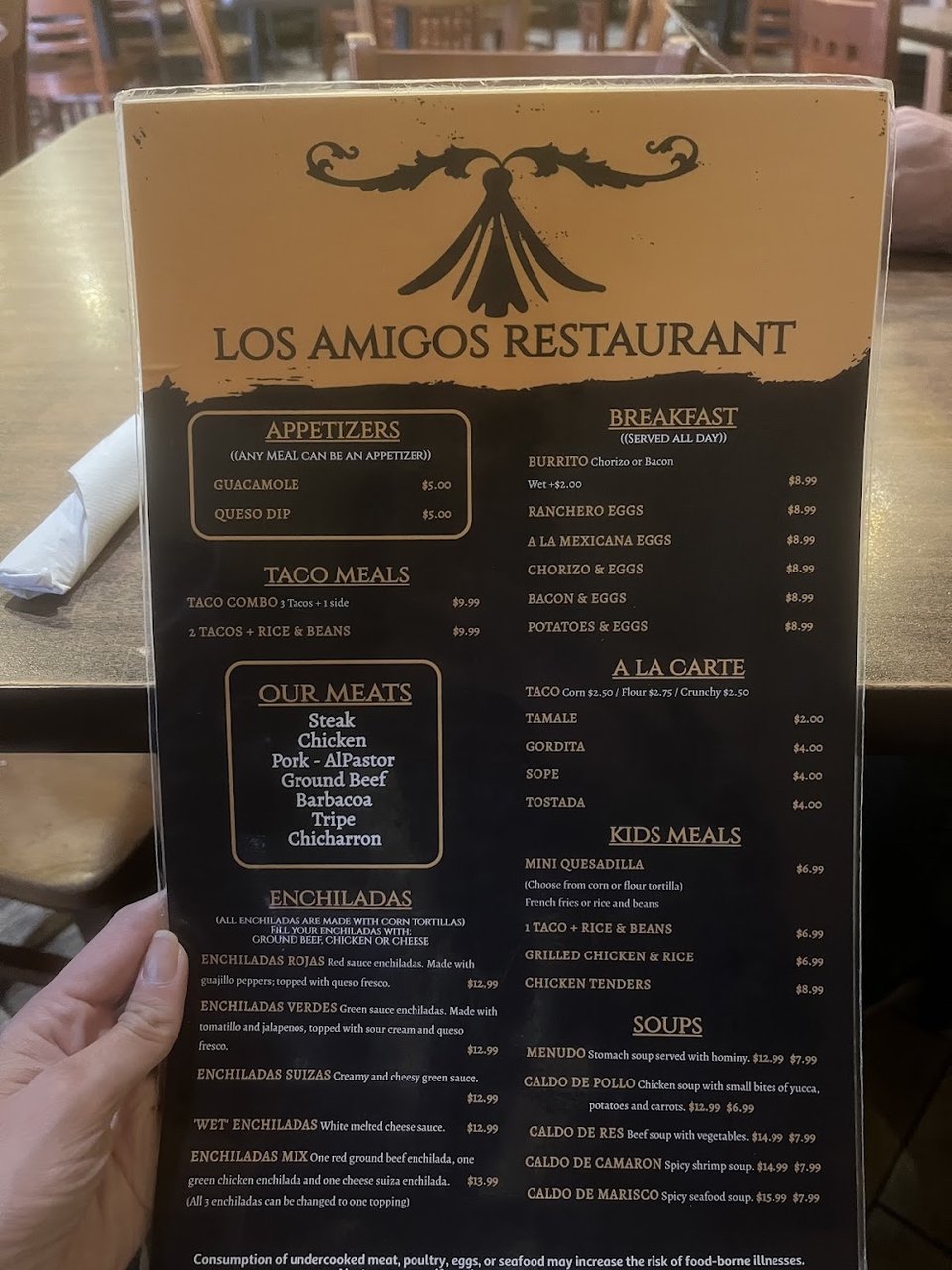 Food menu featuring soups, tacos, and small plates.